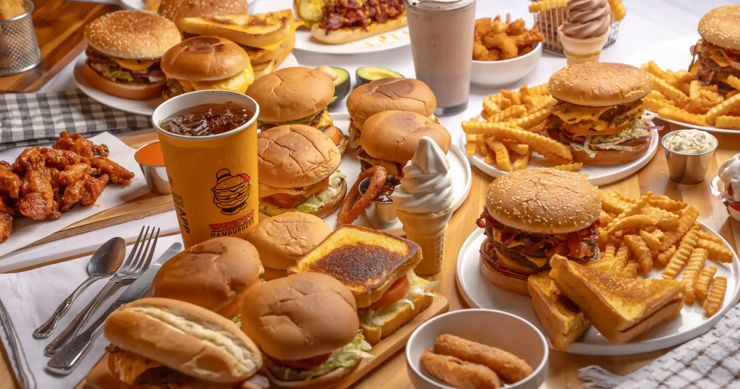 A table of Wimpy’s burgers, fries, onion rings and drinks